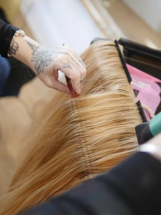 Precise placement during a blonde extension installation