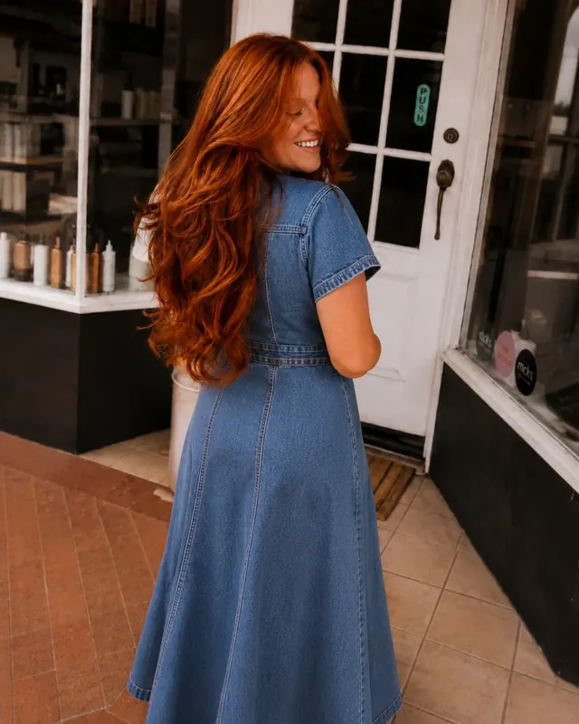 Long copper red hair in a salon lifestyle portrait